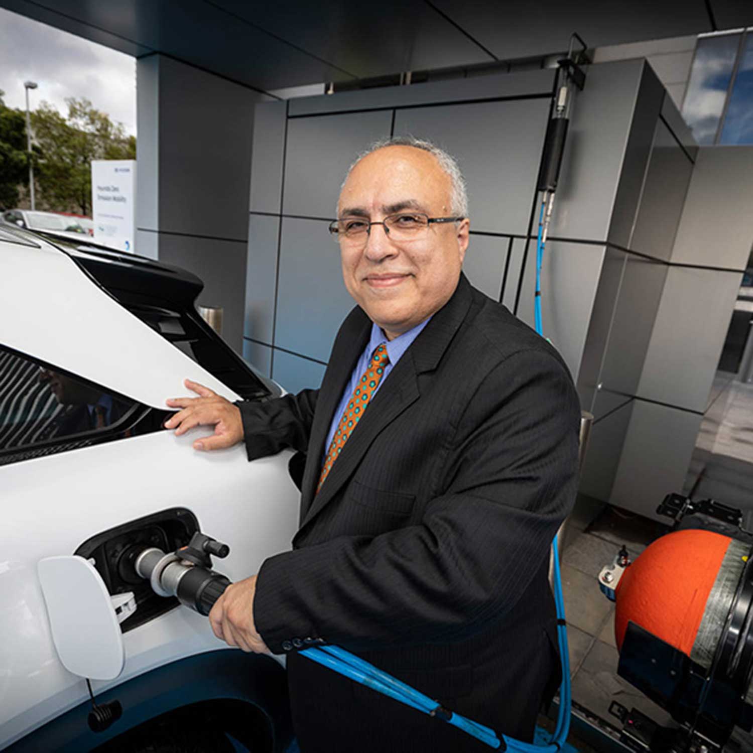 Professor Behdad Moghtaderi refills a hydrogen vehicle with his team's Green Hydrogen