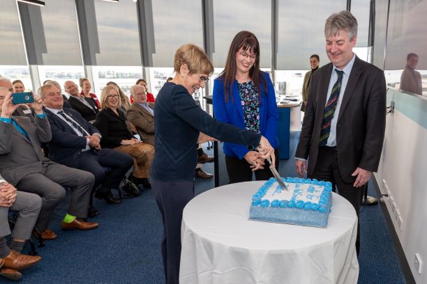 Image of Her Excellency, Amy Maguire and Shaun McCarthy cutting ceremonial cake