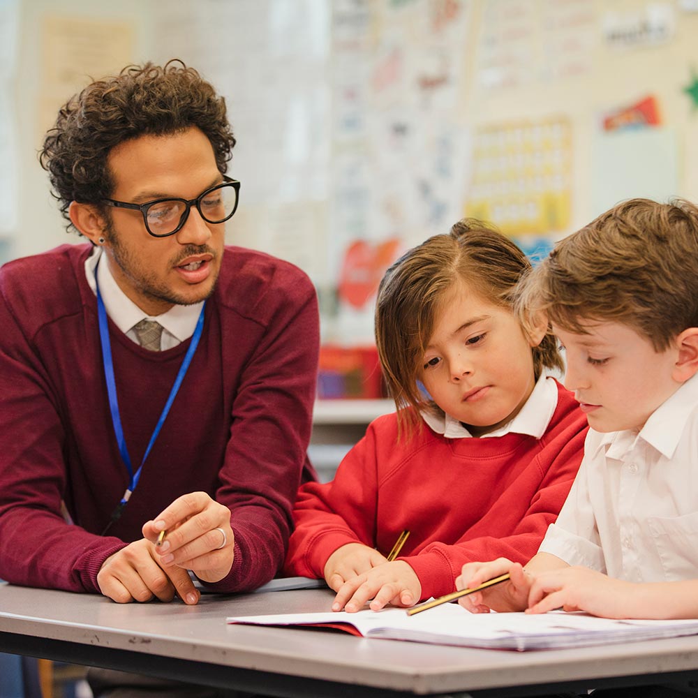Children reading with teacher