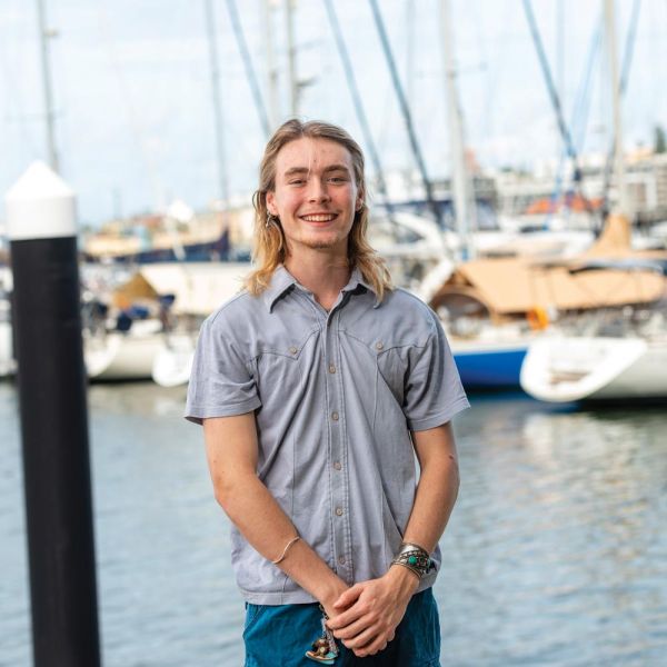 photo of blonde mate student in front of lake