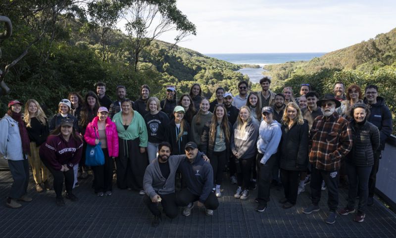 A group of people standing in a bush lookout