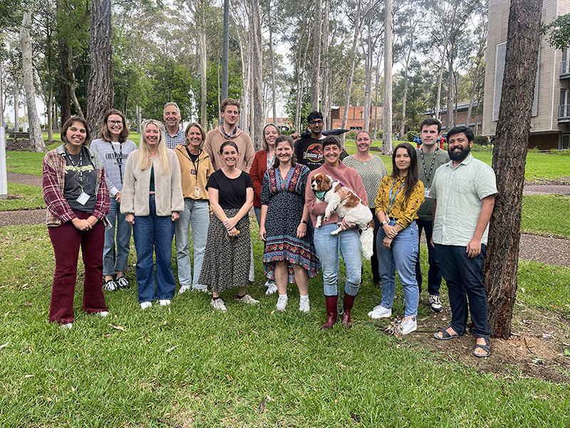 A group of people standing amongst trees