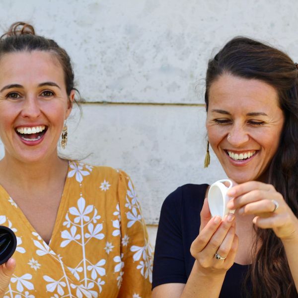 Mika and Zoe smiling and holding their startup invention. University of Newcastle’s I2N takes out top honours.