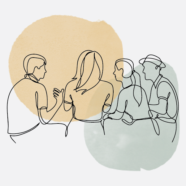 A group of students chatting in a circle sitting down