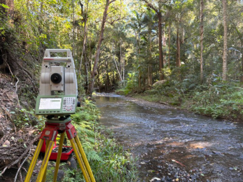Image of surveying equipment in bushland setting