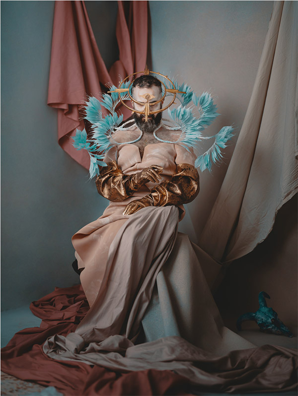 Artwork of man in flowing dress with artistic head wear elements