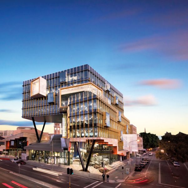 NUSpace building during sunset or sunrise, from across the road.