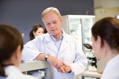 Laureate Professor John Aitken speaking to researchers 