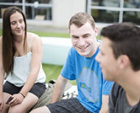 Students talking on a rooftop. Out of Home Care on-campus day
