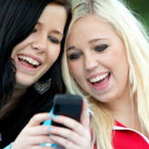 Two young women with mobile phone