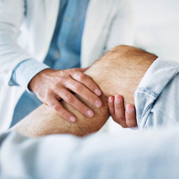 Dr looking at patient's knee. $1.5 million project aiming to deliver ‘precision rehabilitation’