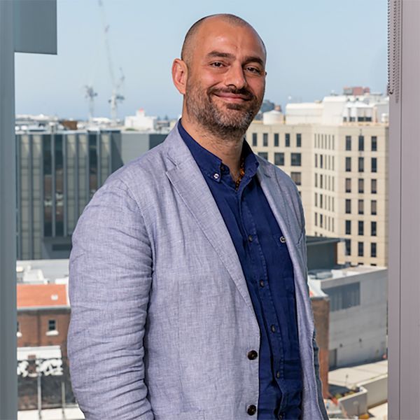 researcher, Francesco, with view overlooking Newcastle city. Global discussion on the future of healthcare systems amid COVID-19 
