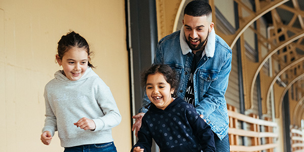 Three people smiling