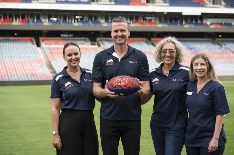 Mark and Kirralee Hughes with two of their team members