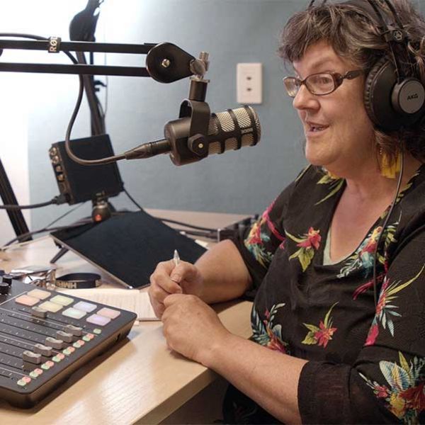 Person recording a podcast - Preparing to record a Podcast