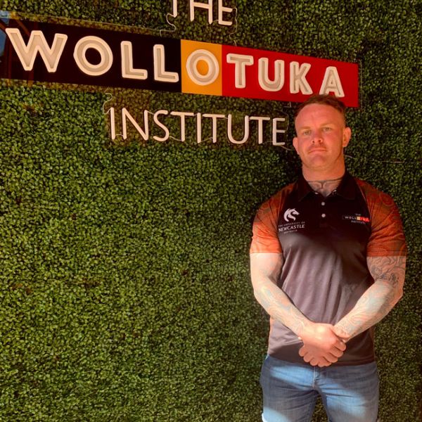 student, Scott, pictured standing proudly in front of the Wollotuka Institute signage. Yapug opens the way for a young doctor in the making 