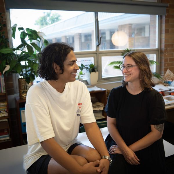 Kat and Tom pictured chatting in a classroom. Kat’s love of teaching inspiring students to follow in her footsteps .