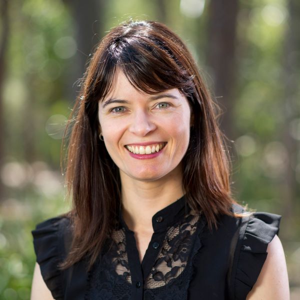 Headshot of Associate Professor Amy Maguire smiling to camera