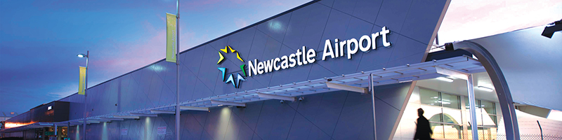A person walking into Newcastle Airport terminal