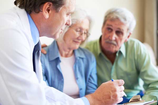 dementia-carer A doctor speaking to two elderly people