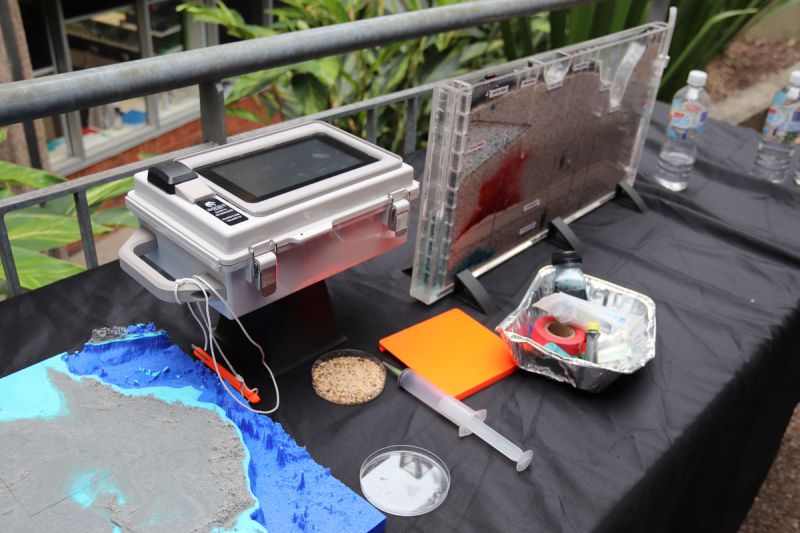 Earth Science equipment sits on display on a table outside the event venue