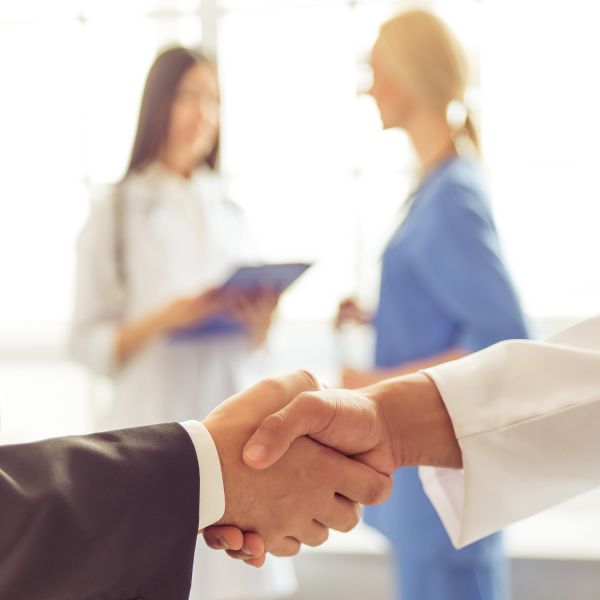 shaking hands in hospital. NSW regional alliance takes centre stage