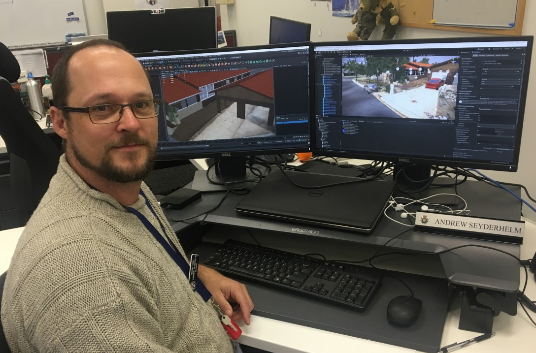 Andrew Seyderhelm at desk