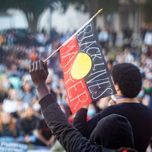 Black Lives Matter flag held high. Black Lives Matter statement