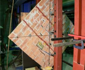 FRP retrofitted masonry panel subjected to large displacement under shear loading