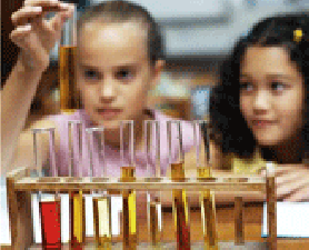 Students in science lab. Investing in Teaching