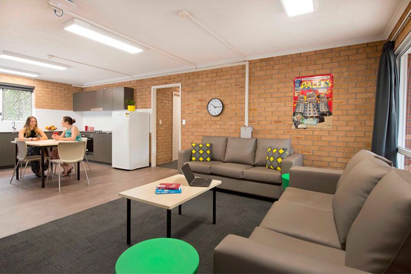 Residents relaxing in Evatt House kitchen and dining room