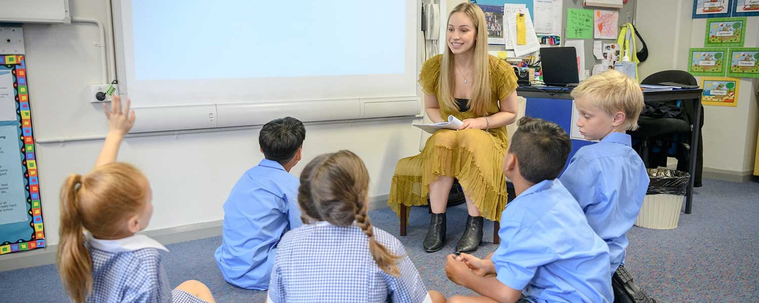 Students sitting in classroom with teacher
