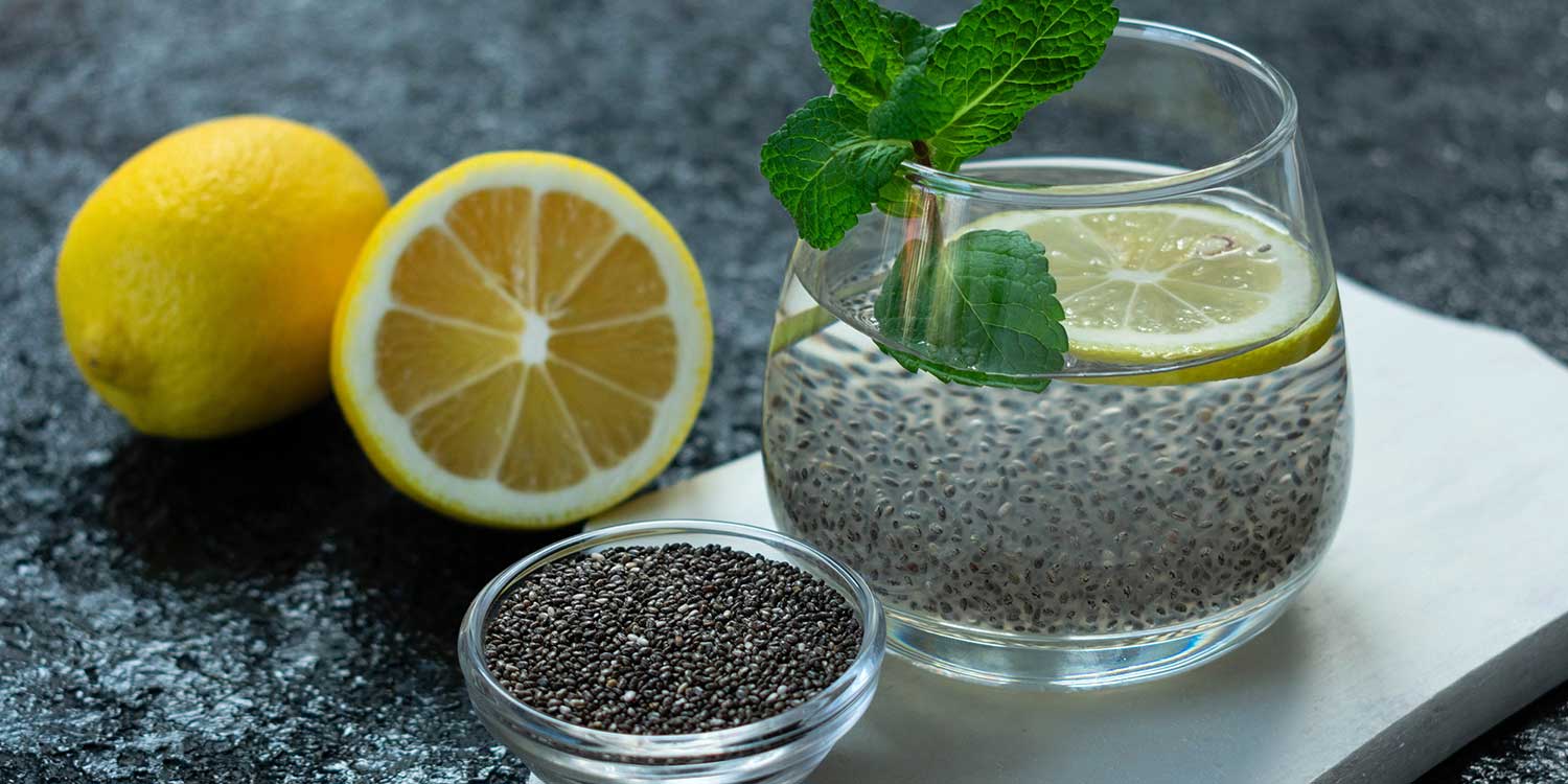 Close up on a glass with chia seeds, water, lemon and mint.
