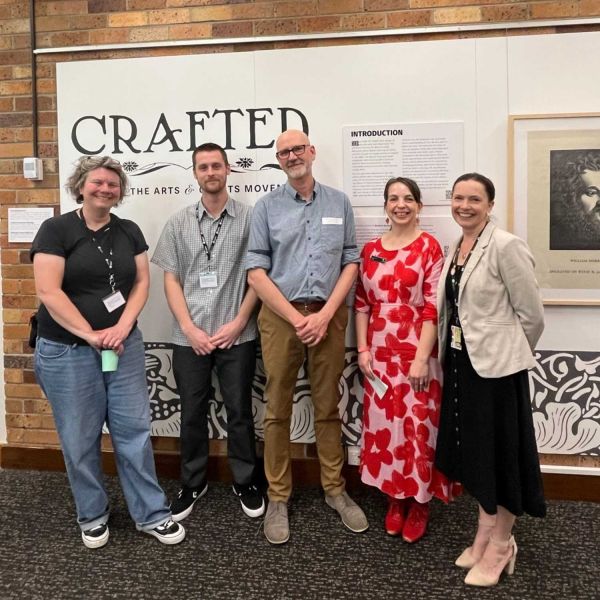 Group of people at CRAFTED Exhibition Opening. Exhibition on Now CRAFTED: Books of the Arts and Crafts Movement