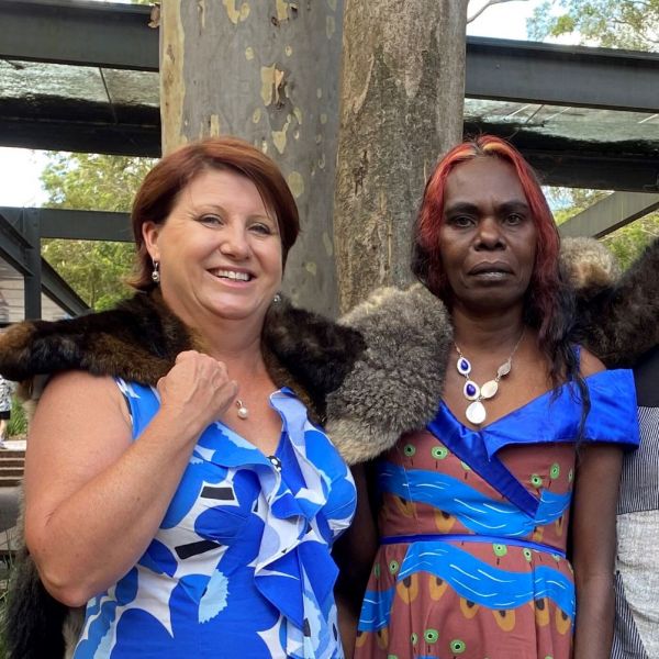 Head & shoulders shot of two academic women smiling. Nunggubuyu woman Daphne Daniels honoured at graduation