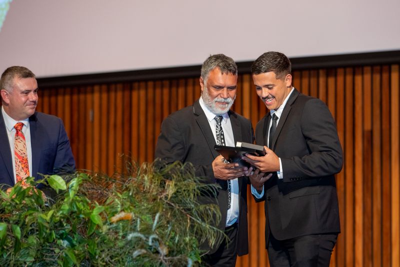 Quincy Ross accepts the Reconciliation Award for student achievement from Dr Ray Kelly and Mr Nathan Towney. Quincy Ross receives the Student award for Reconciliation