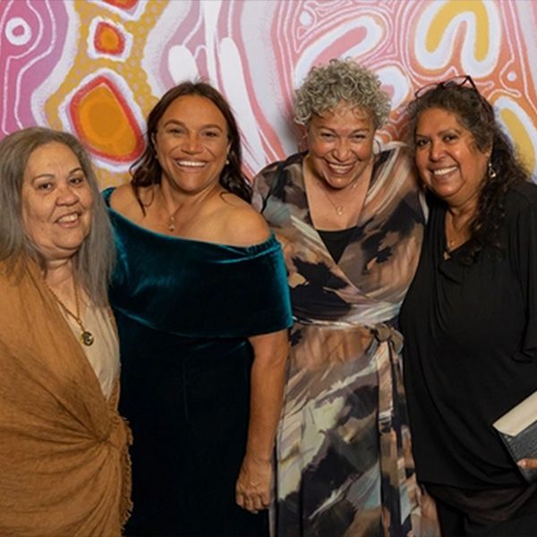 Four women smile at the camera at the 2023 reconciliation ball 