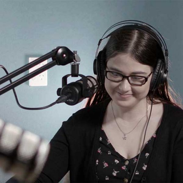 Person recording a podcast - Podcasting tips and tech