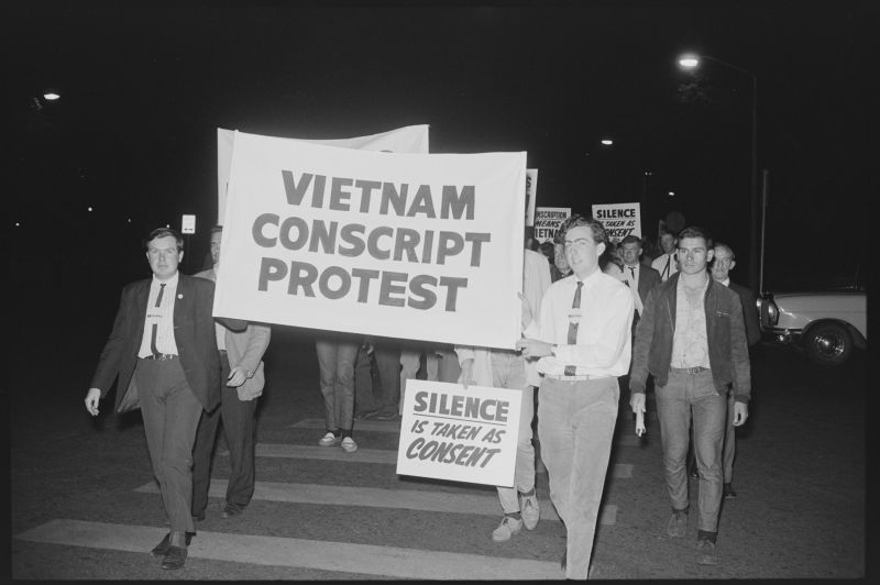 Protesters holding large sign