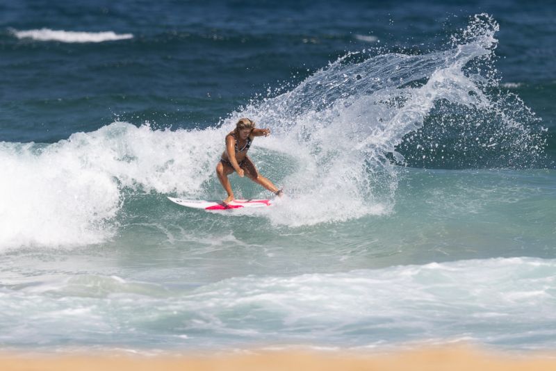 Woman surfing a wave