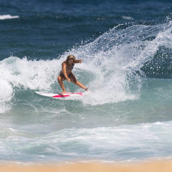 Woman surfing a wave