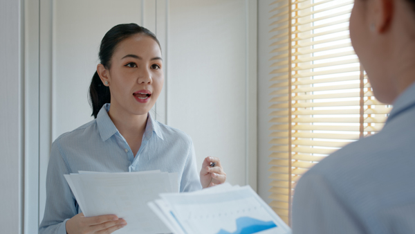 Person practising script Person practising script in front of a mirror