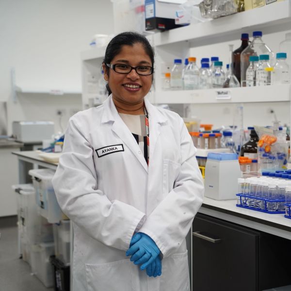 A head and shoulders photo of Dr Ayanka Wijayawardena in her lab. University of Newcastle recognised as national leader in equity.