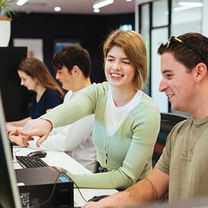 Two students working together at a computer