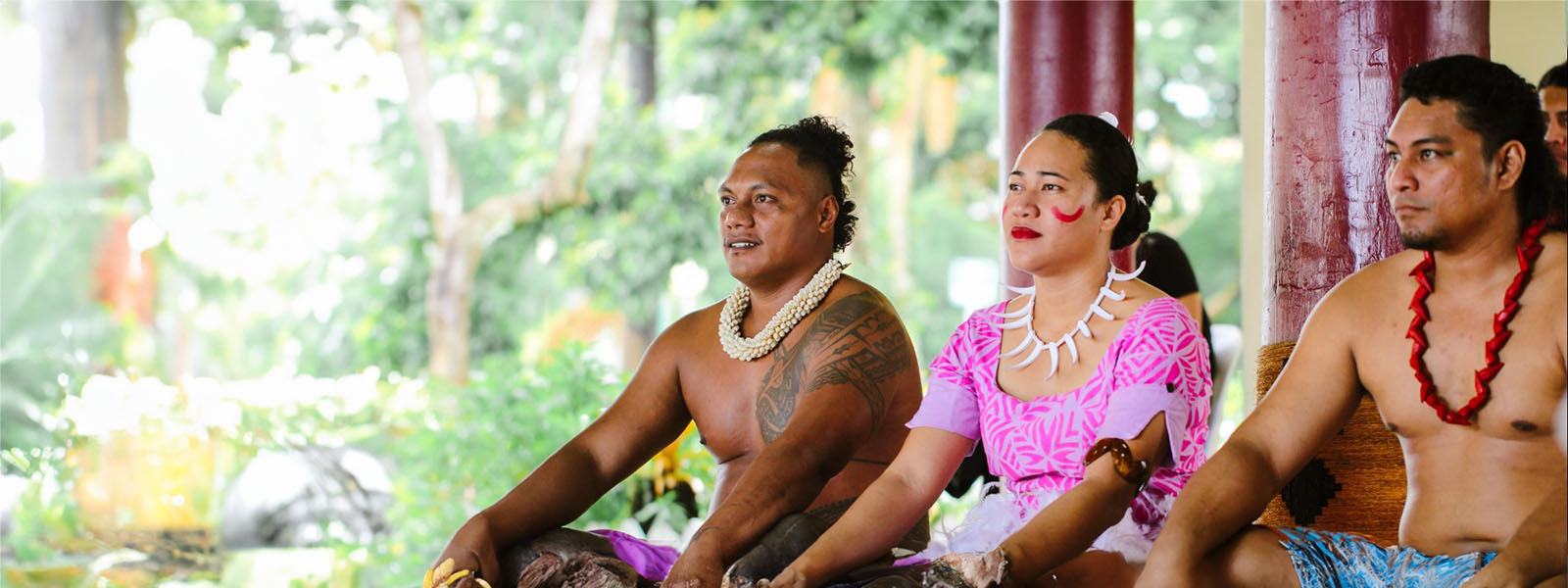 Three pacific islanders sitting next to one another