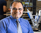 Reza. UON researcher collects prestigious medal.