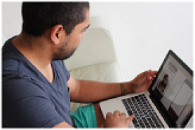 Dad on computer. PHD SCHOLARSHIP – SMS4dads mobile phone information and support for new fathers