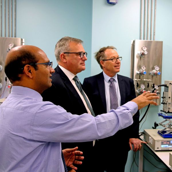 (L-R): Professor Ajayan Vinu, Vice-Chancellor Professor Alex Zelinksy AO, Chief Executive Officer of Newcastle Airport Dr Peter Cock in the nanotechnology lab. New partnership encouraging innovation and regional economic growth takes flight 