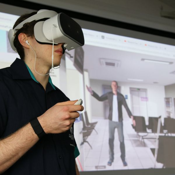 Bachelor Nursing student Damian Moore uses virtual reality conflict resolution . Ground-breaking conflict simulator helps train budding nurses 