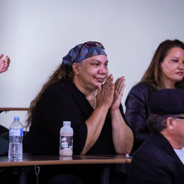 Distinguished guests and speakers watching the Purai event